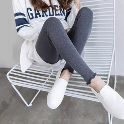 femme assisse legging de grossesse noir clair