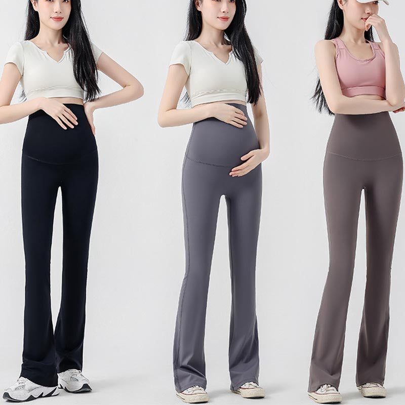 femme enceinte main ventre legging grossesse evases