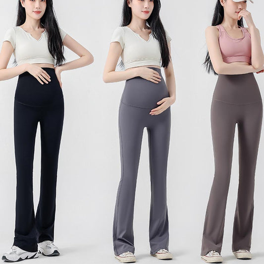 femme enceinte main ventre legging grossesse evases
