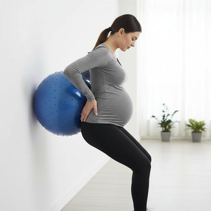 femme enceinte tenu sport en train de se masser ballon grossesse pvc bleu