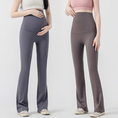 femmes enceinte legging grossesse evase main ventre